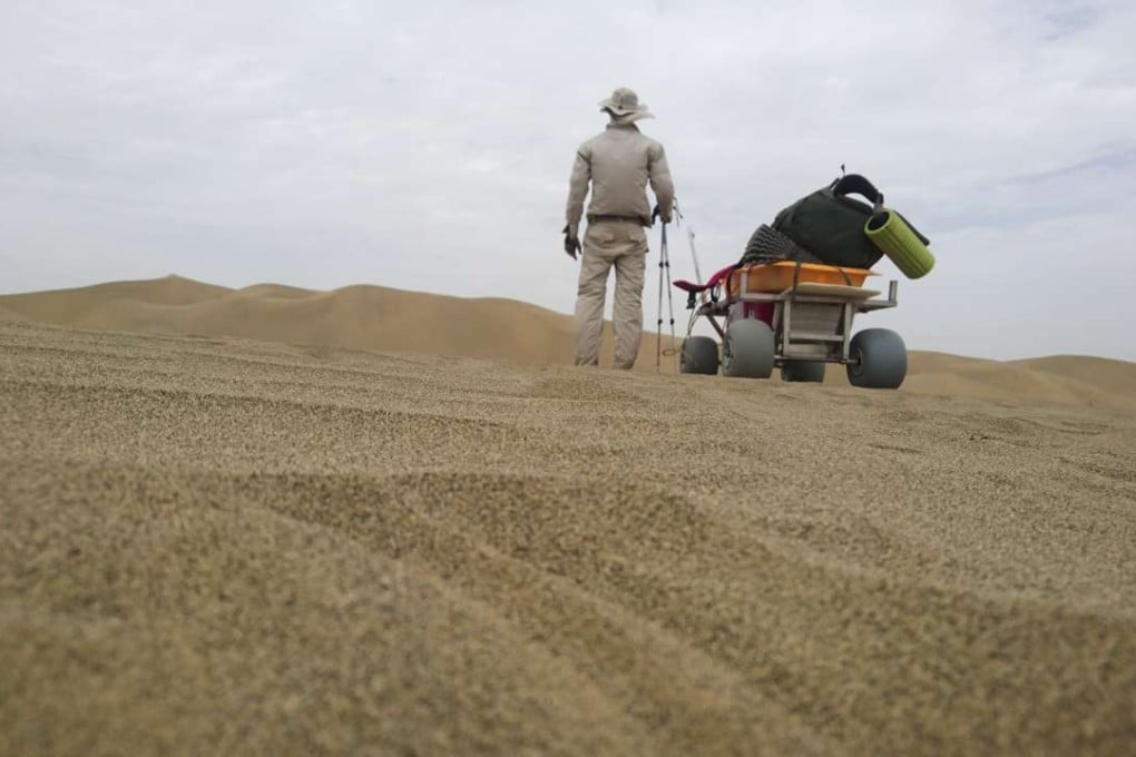 Rob Lilwall tries out the cart.