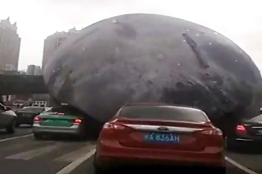 The moon – a giant inflatable blown off its moorings in the city of Fuzhou – was filmed bouncing and rolling along highways in a video that went viral.Photo: SCMP Pictures