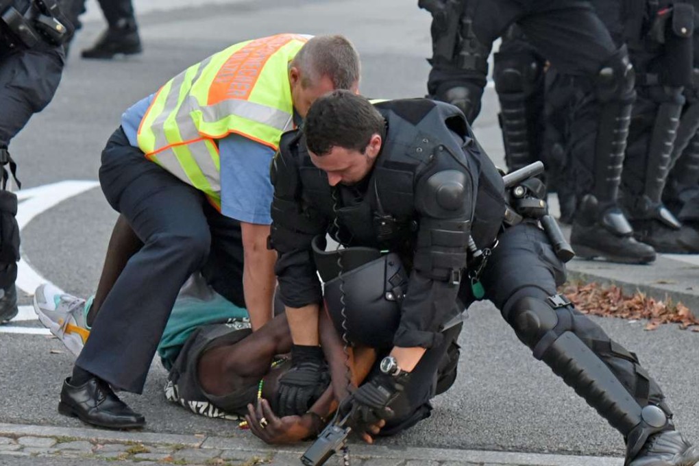 A picture made available on Thursday shows German police officers taking a man into custody during a gathering at the Kornmarkt square in Bautzen on September 10. Photo: EPA