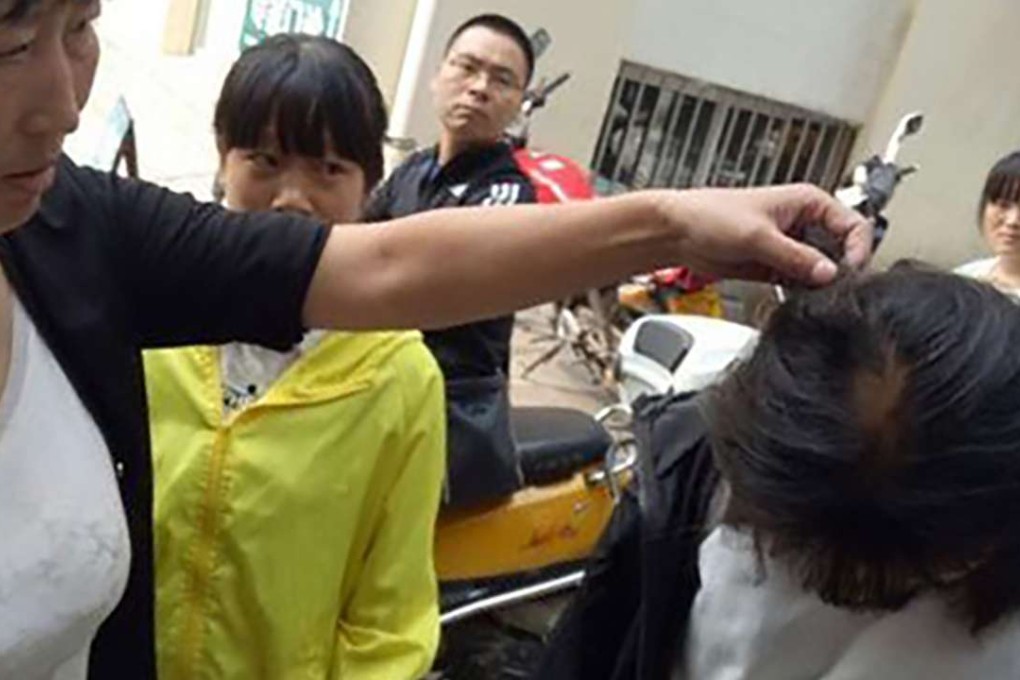 The mother of a student, Cui, said the Guo couple pulled out her daughter’s hair. Photo: SCMP Pictures