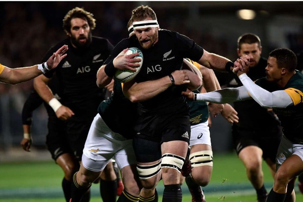 New Zealand captain Kieran Read is tackled by South Africa's Vincent Koch and Juan de Jongh. Photos: AFP