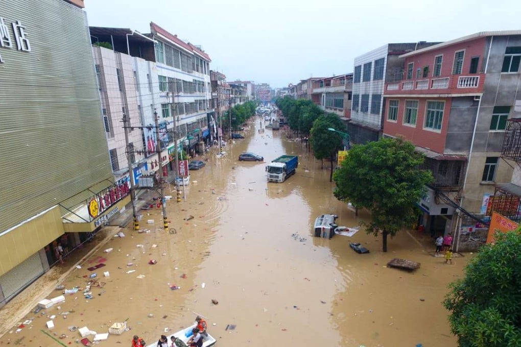 Rescuers move trapped residents in Nanan, in Fujian province, on Friday. Photo: Xinhua
