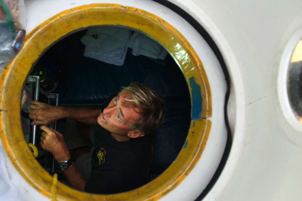 Pisces V submersible pilot Terry Kerby, with the Hawaii Undersea Research Laboratory at the University of Hawaii, loads the deep sea vehicle before a dive to the summit of the Cook seamount. Photo: AP