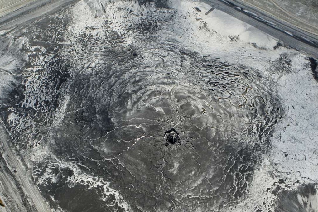 This aerial photo shows a massive sinkhole that opened up at a Mosaic fertiliser plant. Photo: AP