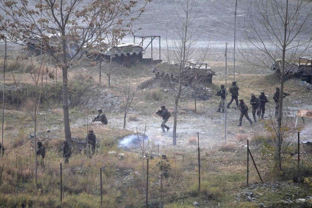 Indian soldiers search for suspected militants as smoke rises from a bunker after a gunbattle in Mohra in Uri in 2014. File photo: Reuters
