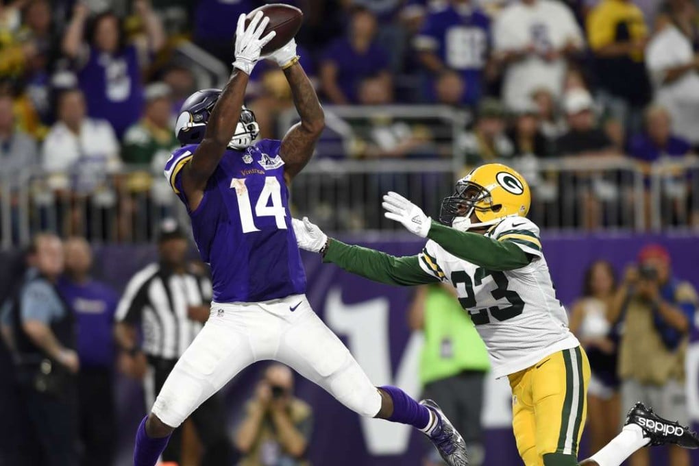Stefon Diggs (14) of the Minnesota Vikings makes a leaping catch for a touchdown over defender Damarious Randall (23) during the Vikings win over the Green Bay Packers. Photo: AFP