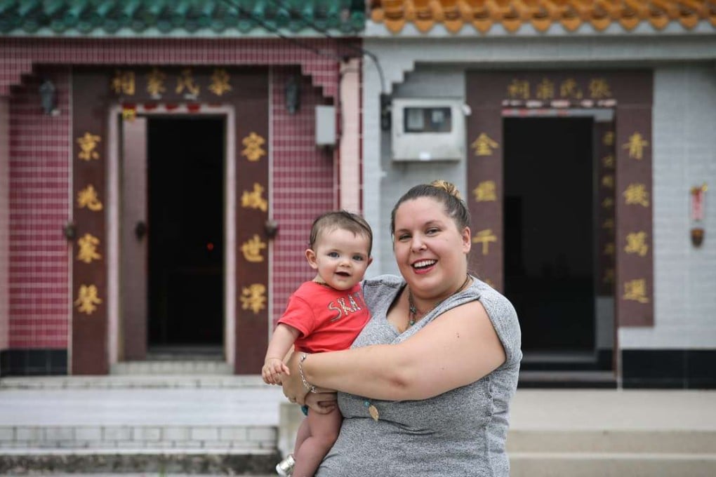 Jen Ritchie, with son Arlo, says the space and quiet of rural life outweigh the benefits to be found in the city. Photo: Sam Tsang