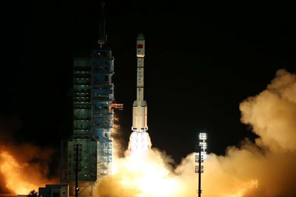 The space lab Tiangong 2 heads into orbit on the back of a Long March 2F rocket from the Jiuquan Satellite Launch Centre. Photo: Xinhua