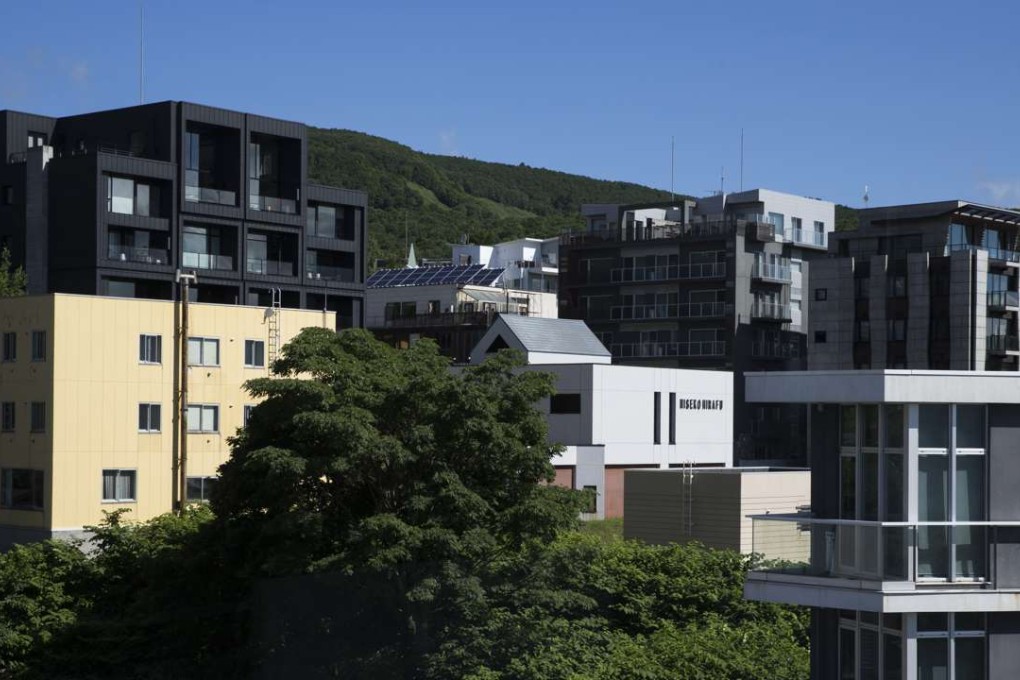 Hotels and apartments stand in the Hirafu area of Kutchan, Hokkaido, Japan, on July 20, 2016. The Niseko area’s booming economy has spurred investment in luxury hotels, restaurants, and shops. Photo: Bloomberg