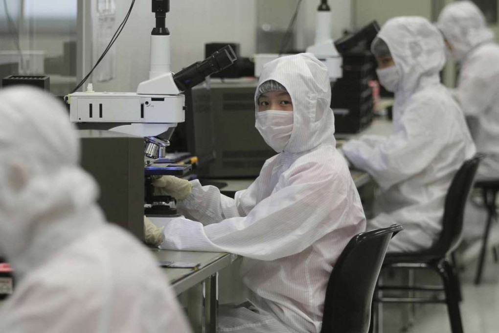 Employees work in a laboratory in China. The Ministry of Agriculture’s investigation into the National GMO Testing Centre begins on Tuesday. Photo: Reuters