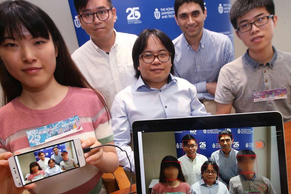 Researchers, including Pan Hui (centre) demonstrate technology for protecting people who do not want to be photographed. Photo: David Wong
