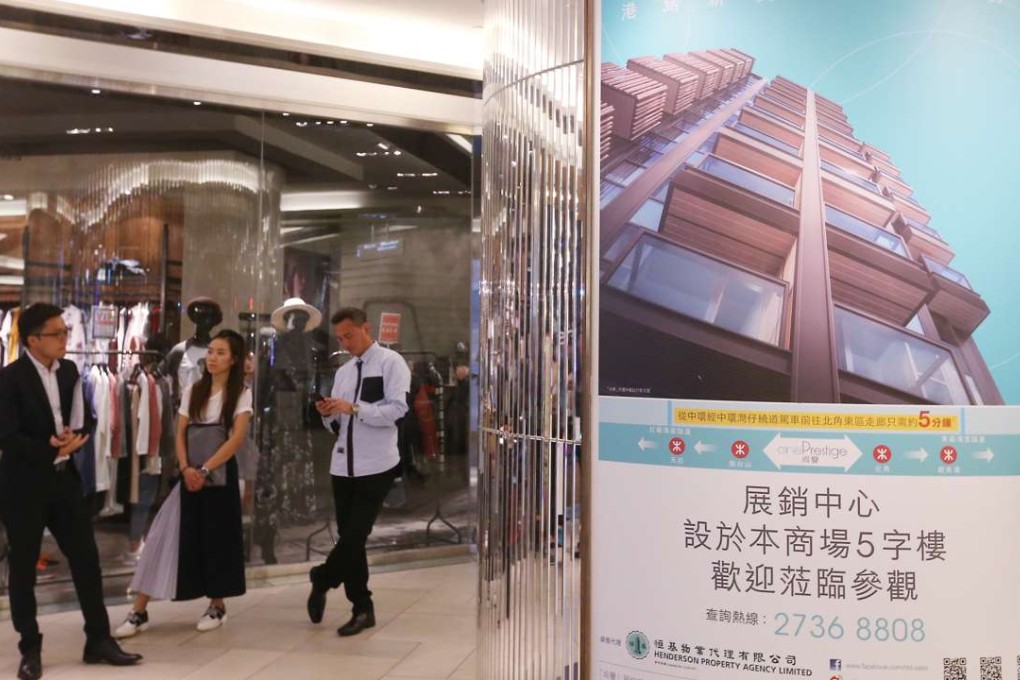 Potential buyers wait outside the sales office of One Prestige at Mira Mall in Tsim Sha Tsui on Tuesday. Photo: K. Y. Cheng