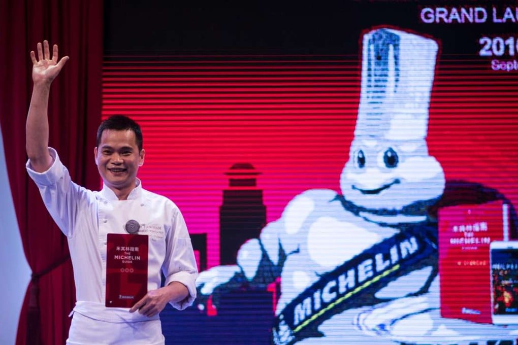 Master chef of T'ang Court Justin Tan reacts after the announcement the restaurant has been awarded three Michelin stars in the French company’s first guide to Shanghai dining. Photo: AFP