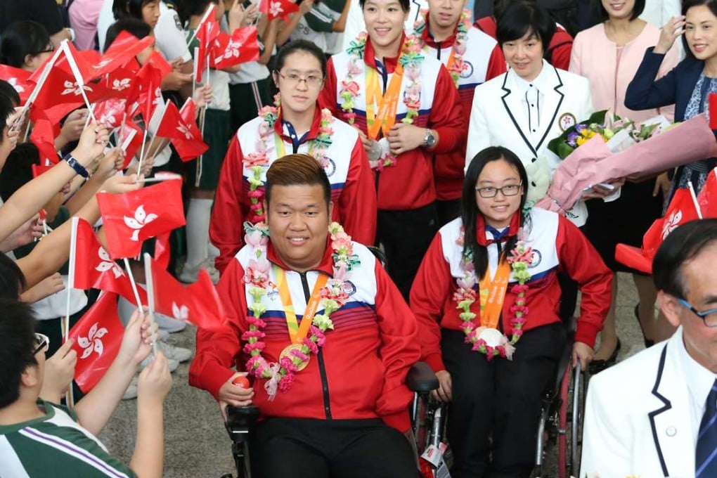 Rio Paralympic Games gold medallist Leung Yuk-wing leads the Hong Kong squad as they are welcomed back on their return. Photos: K. Y. Cheng