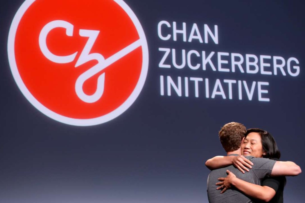 Pricilla Chan and husband Mark Zuckerberg embrace while announcing the Chan Zuckerberg Initiative to cure, prevent or manage all disease by the end of the century during a news conference in San Francisco on Wednesday. Photo: Reuters