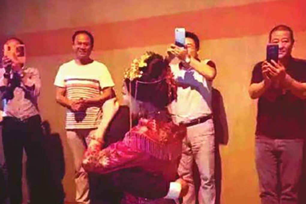A couple had an impromptu wedding ceremony in a highway tunnel after becoming trapped in a traffic jam on the way to their wedding venue. Photo: SCMP Pictures