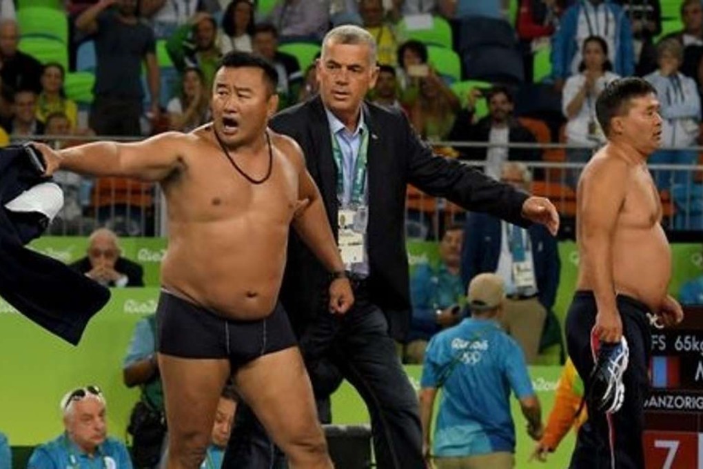 The Mongolian coaches who stripped at the Olympics in Rio have been hit with three year bans.