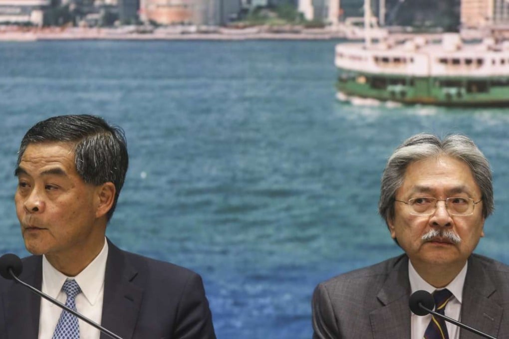 Leung chun- ying HKSAR CE and John Tsang Chun-wah Financial Secretary attend presser on housing project in Wang Chau, at CGO. 21SEP16 SCMP/While Leung put on a brave face, observers noted, Tsang looked sullen in front of the cameras for the first time after publiclydistancing himself from the controversy. Photo: Sam Tsang