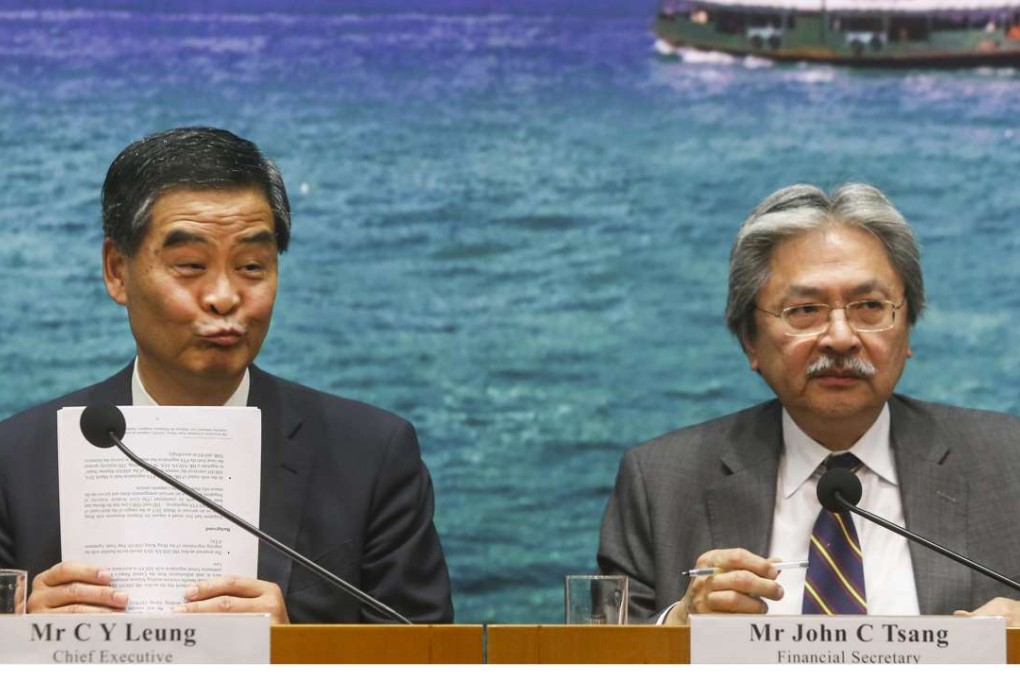 Chief Executive Leung Chun- ying and Financial Secretary John Tsang Chun-wah discussing the Wang Chau housing controversy on Wednesday. Photo: Sam Tsang