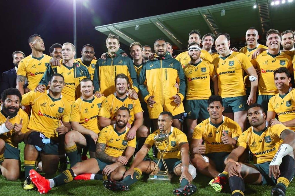 Australia pose with the Puma Cup after winning the Rugby Championship match against Argentina. Photo: EPA