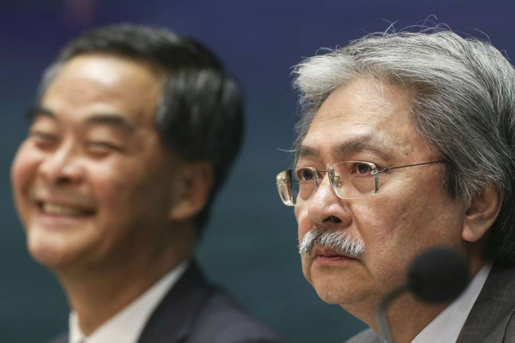 A relaxed Leung Chun-ying and a stern John Tsang face the press. Photo: Sam Tsang