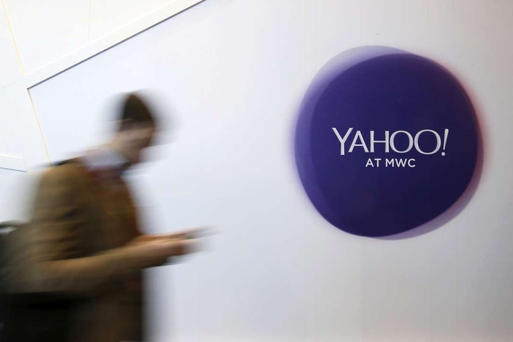A man walks past a Yahoo logo during the Mobile World Congress in Barcelona, Spain in February. Photo: Reuters