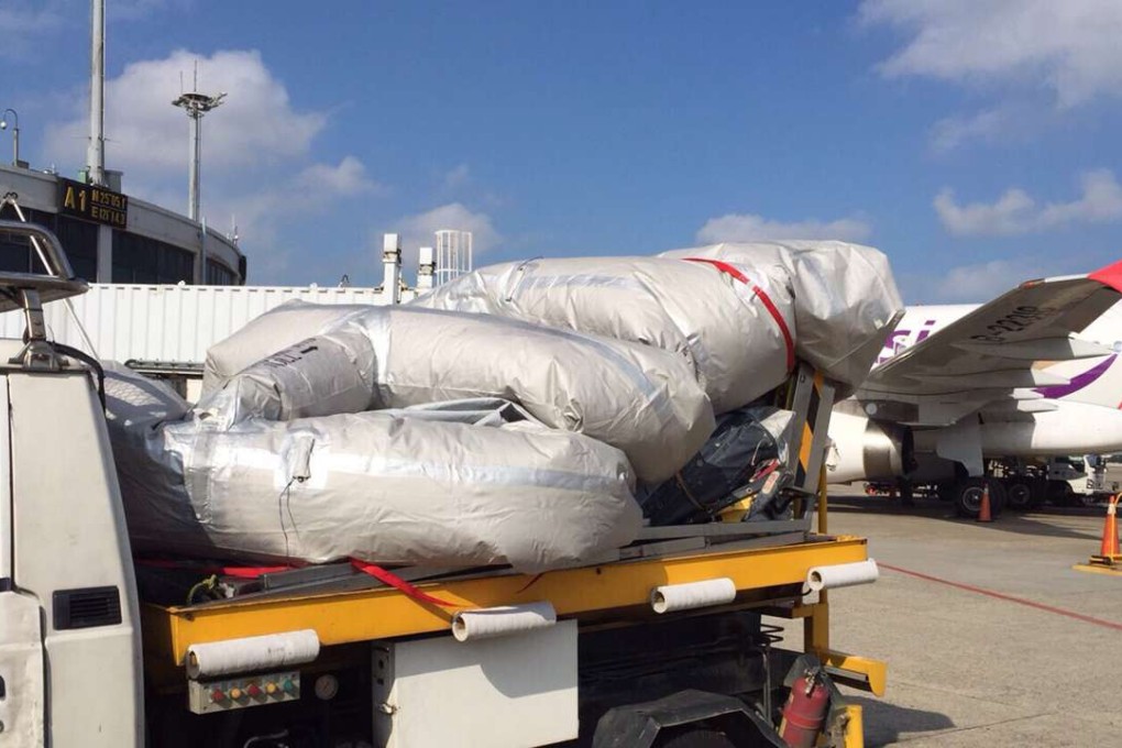 The TransAsia plane’s emergency slide was accidentally deployed at Taiwan's Taoyuan airport. Photo: CNA