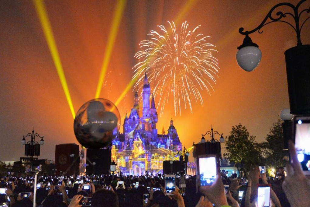 Fireworks light up Shanghai’s Disney theme park on the opening day of the attraction. Photo: Kyodo