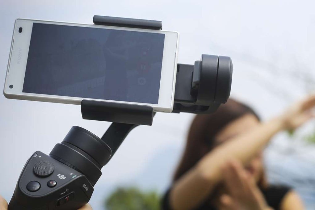 DJI’s Osmo Mobile, which enables smartphone users to shoot more professional-looking videos. Photo: May Tse