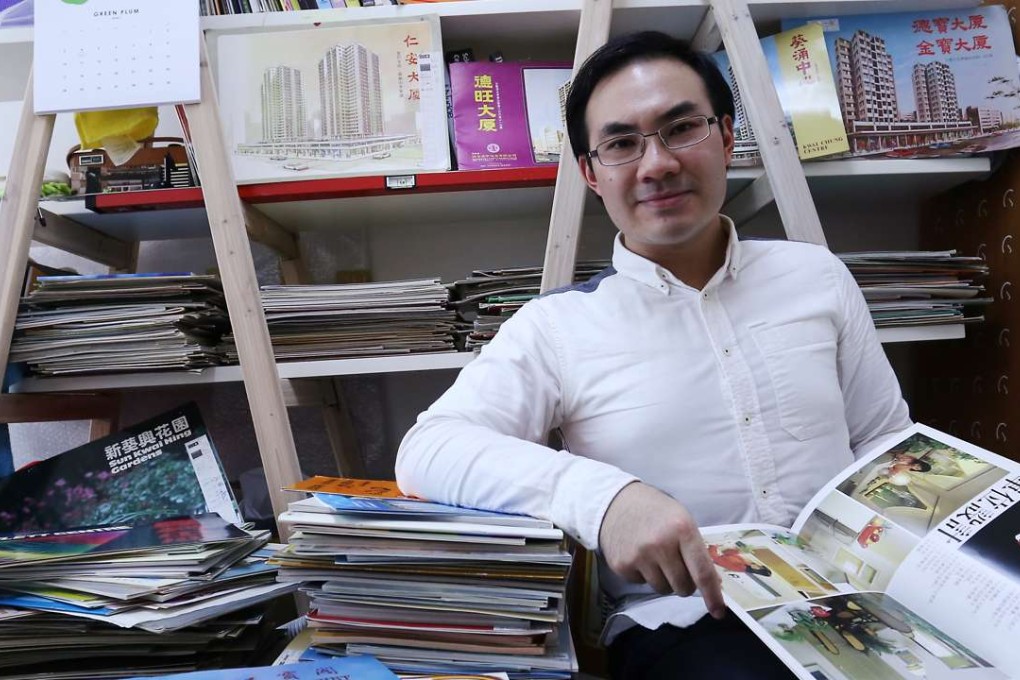 Alfred Ho with his vintage flat brochures. Photo: Jonathan Wong