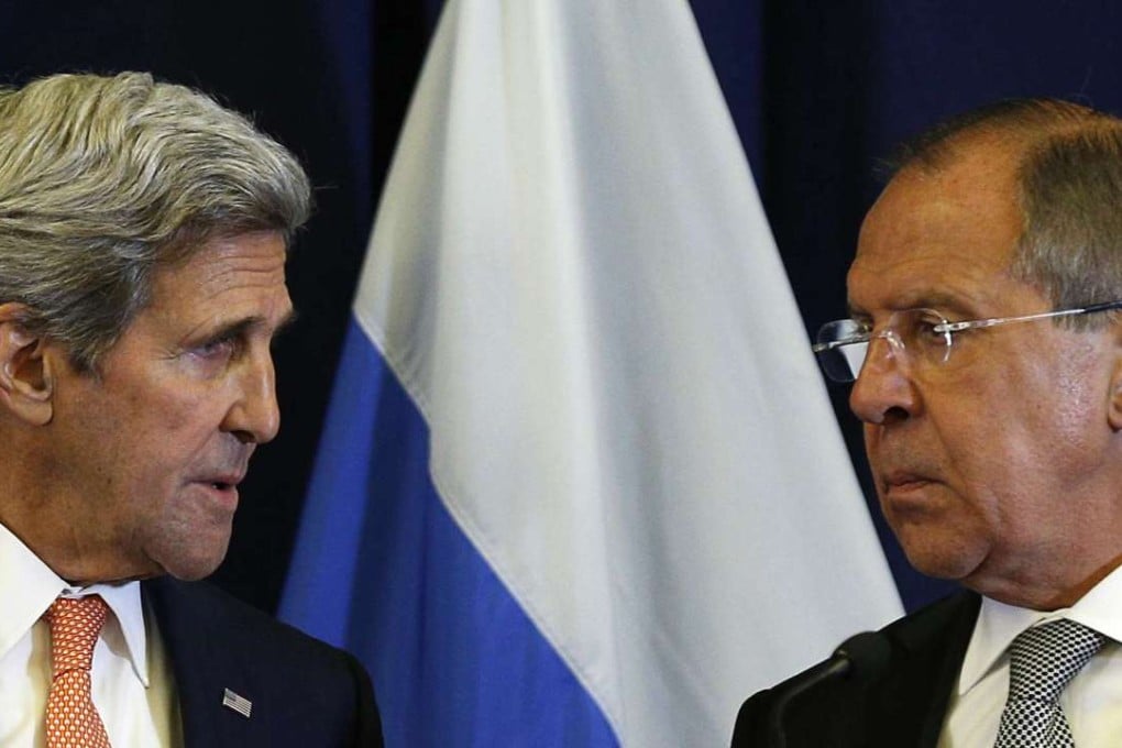 US Secretary of State John Kerry talks with Russian Foreign Minister Sergei Lavrov during their joint news conference in Geneva. Photo: AP