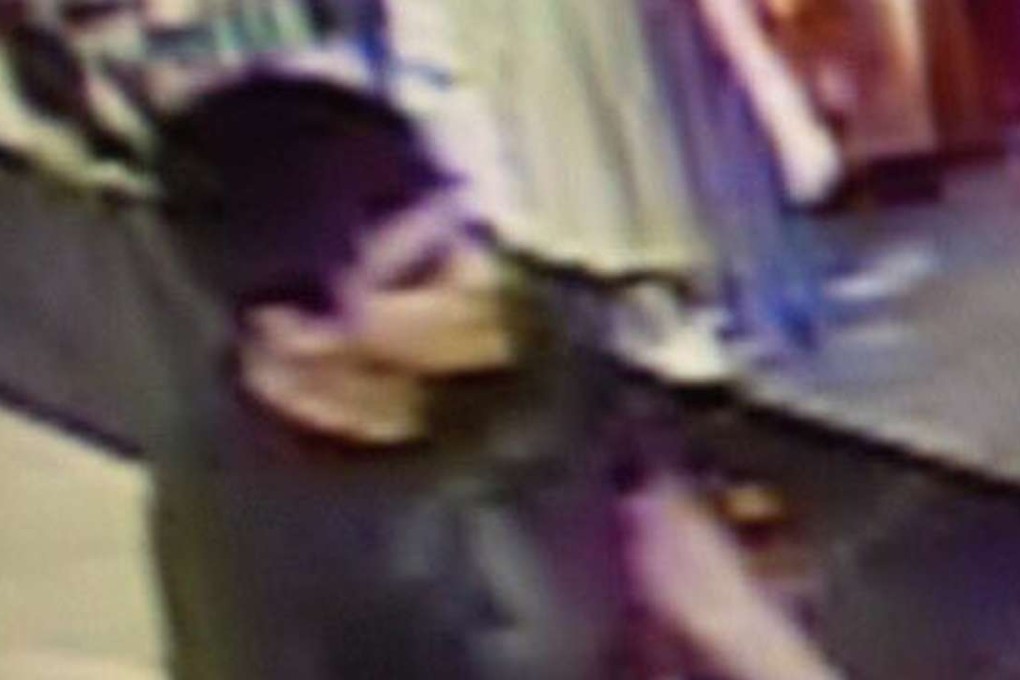 A man believed to be the shooter, armed with a rifle, who Washington State Patrol officers said is wanted in connection in the fatal shooting at the Cascade Mall in Burlington, Washington. Photo: EPA