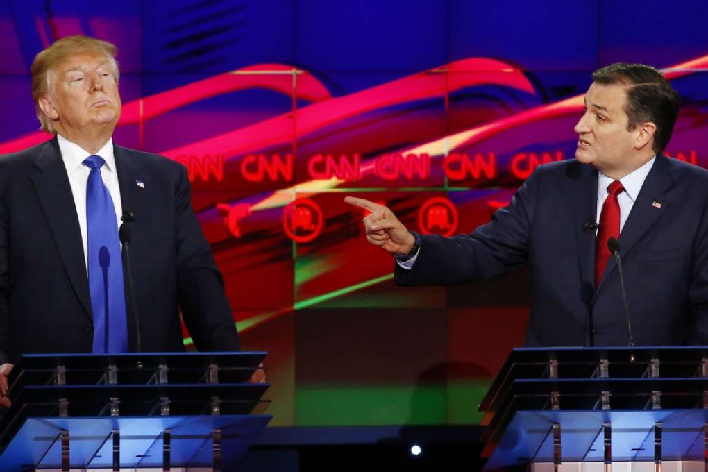 Republican US presidential candidate Ted Cruz challenges rival Donald Trump (L) about releasing his tax returns during a debate in February. File photo: Reuters