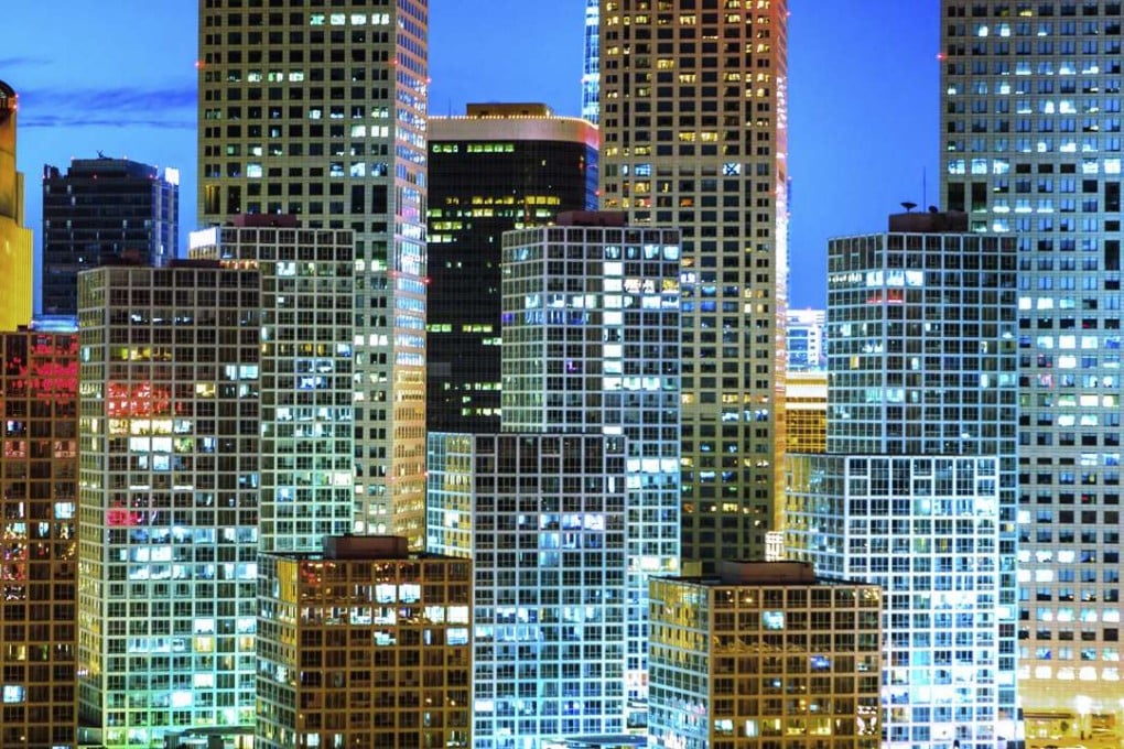 Beijing’s CBD skyline by night. Munich Re says its growing level of business in the Chinese capital makes it sensible to expand its operation there, and in Singapore, while its office in Hong Kong will be scaled back. Photo: Thinkstock