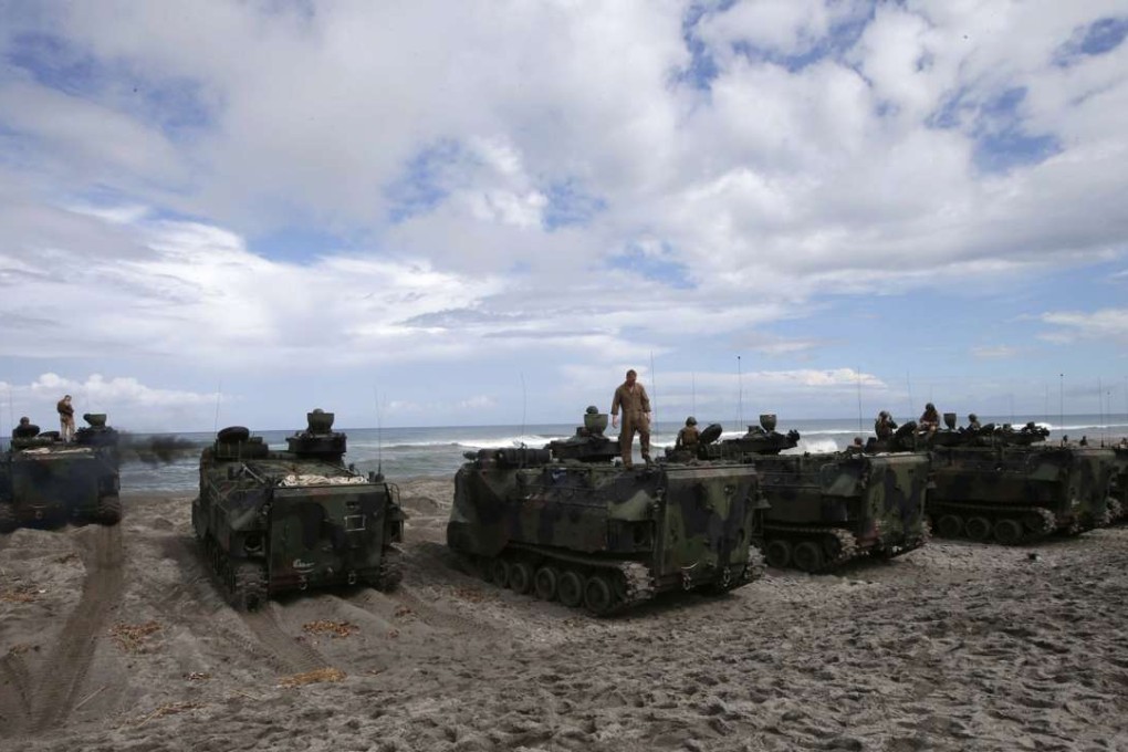 US Marines prepare to manoeuvre their Amphibious Assault Vehicles following a joint US-Philippines naval exercise in 2014, Photo: AP