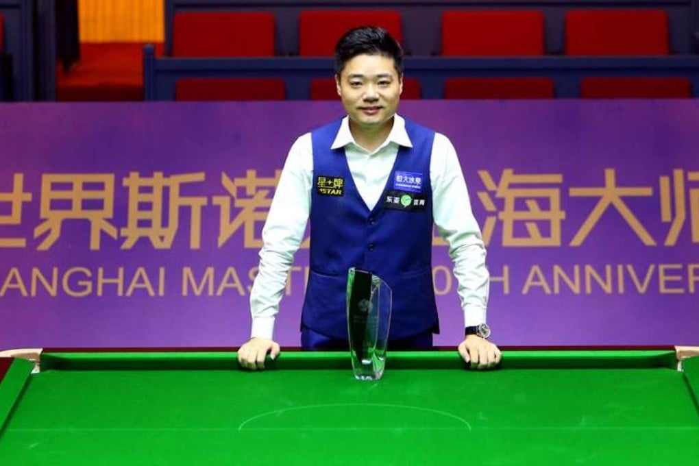 China’s Ding Junhui poses with the Shanghai Masters trophy after securing a 10-6 win over England’s Mark Selby in the final. Photos: Xinhua