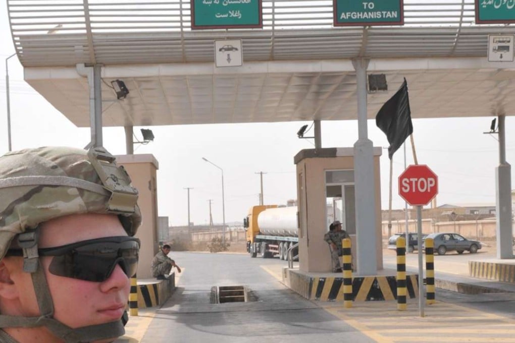 A US soldier stands guard near Afghanistan’s Shir Khan border crossing point with Tajikistan. Photo: SCMP Pictures