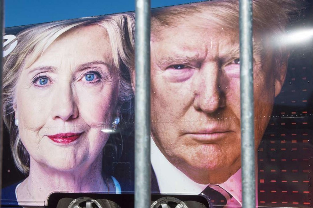 Large images of Democratic nominee Hillary Clinton and Republican nominee Donald Trump are seen on a CNN vehicle, behind a security fence at Hofstra University, in Hempsted, New York. The university is the site of the first Presidential debate. Photo: AFP