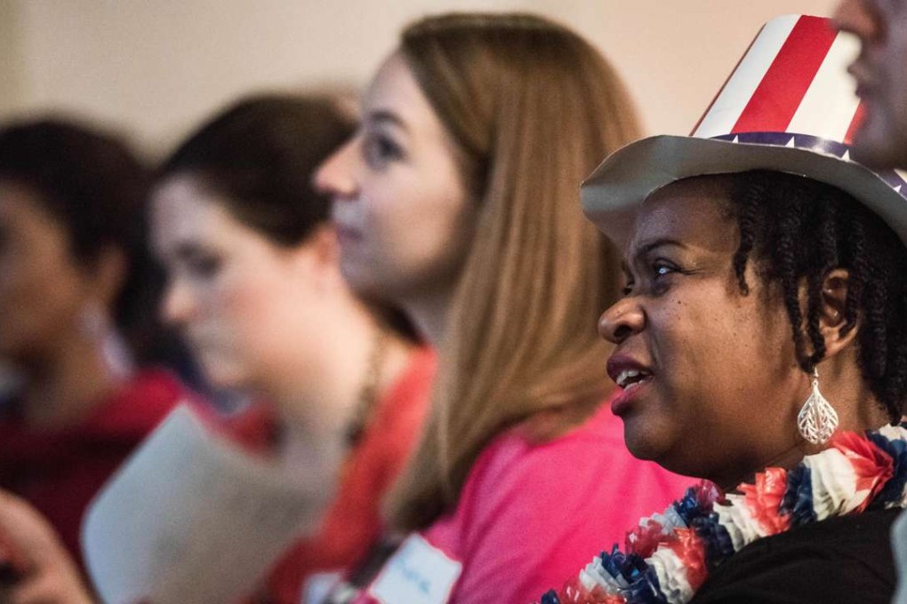 Supporters of Hillary Clinton in South Carolina watch the debate on TV. Photo: AFP