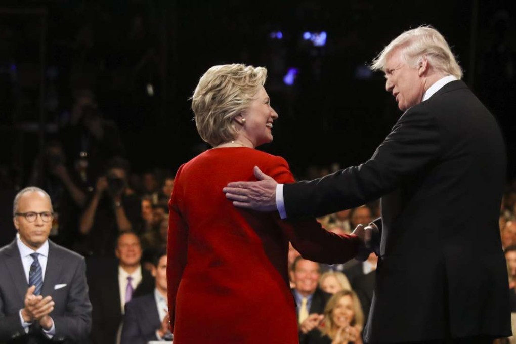 Democratic presidential nominee Hillary Clinton and Republican presidential nominee Donald Trump shake hands during the presidential debate. Photo: AP