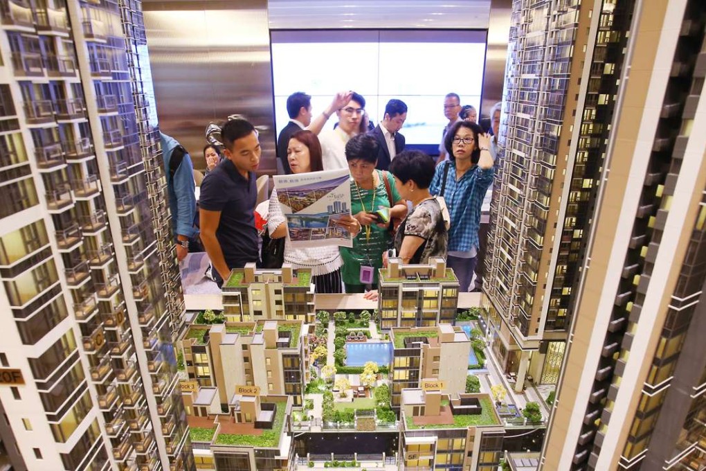 Potential buyers at the sales office of the One Kai Tak development at Exchange Tower in Kowloon Bay. Photo: Dickson Lee