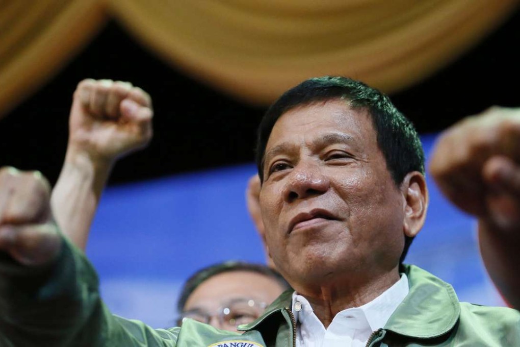 Philippine President Rodrigo Duterte poses with a fist bump during the anniversary of the 250th Presidential Airlift Wing at the Philippine Air Force headquarters in Pasay city, southeast of Manila. Photo: AP