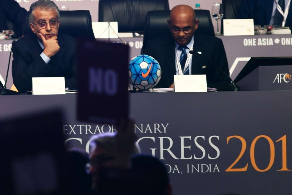 AFC president Sheikh Salman bin Ibrahim Al Khalifa (left) and AFC general secretary Windsor John look on as the vote takes place. Photo: AFP