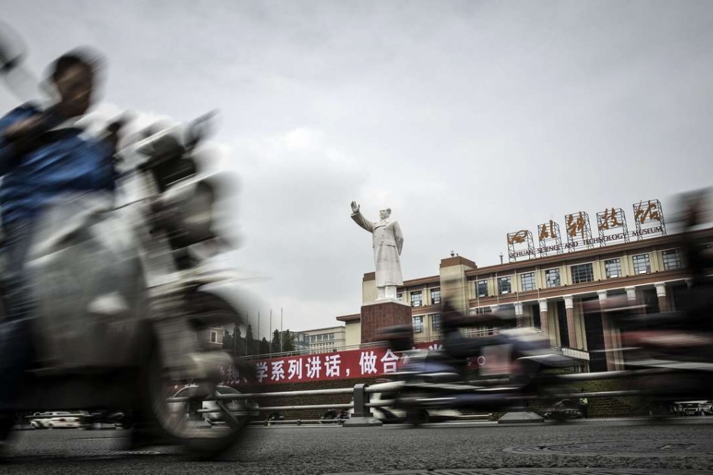 Motorcyclists ride past a statue of Mao Zedong in front of the Sichuan Science and Technology Museum in Chengdu. China’s instinctive response to pressures from net capital outflows, volatile stock markets and imbalances caused by export-led growth is more market intervention. Photo: Bloomberg