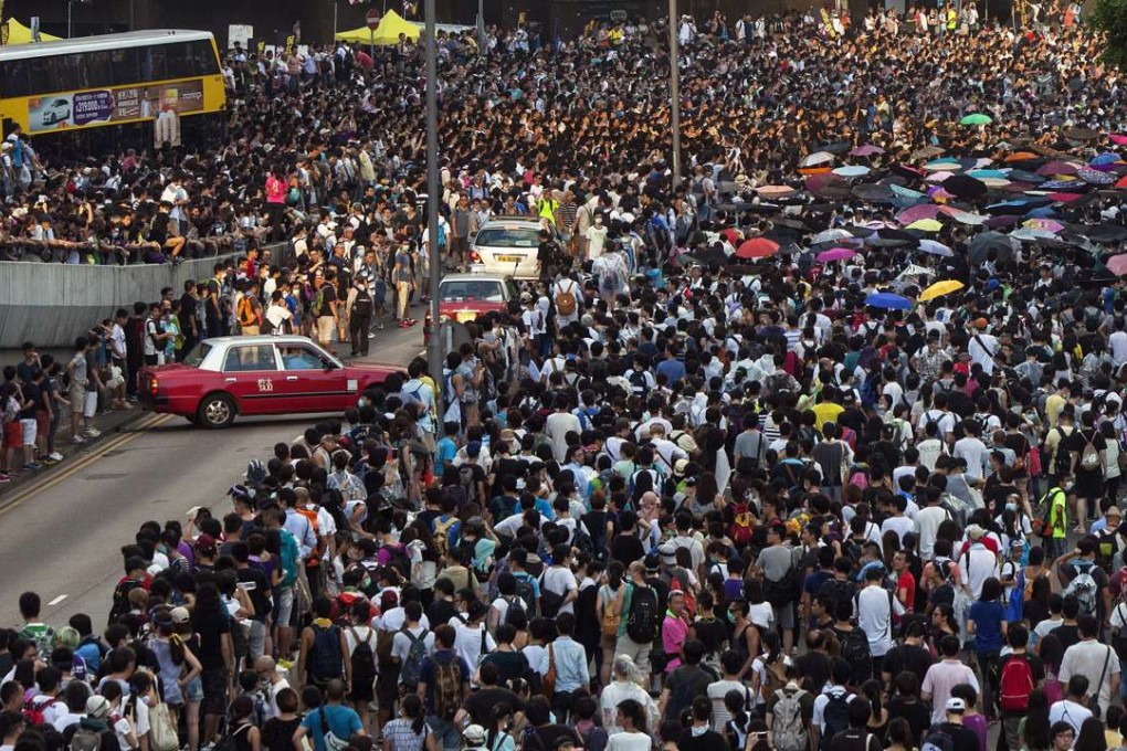 Thousands of pro-democracy protesters blocked the main highway through Admiralty on September 28, 2014 over Beijing’s decision to restrict the nominations for the chief executive elections. Two years later, it remains the wish of Hong Kong people to put in place an acceptable model for universal suffrage. Photo: EPA