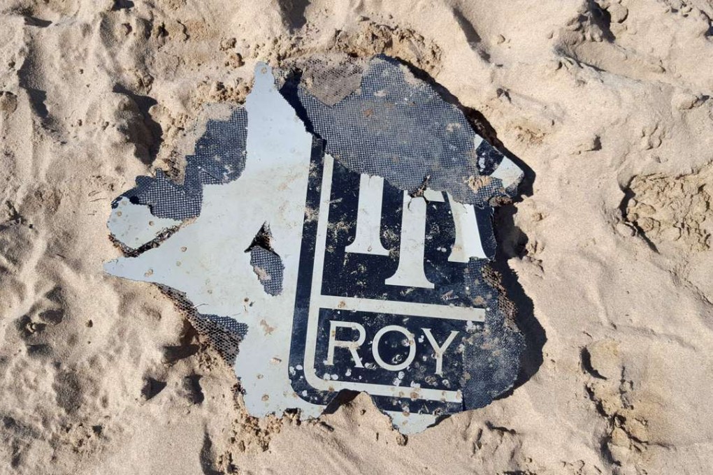 A piece of suspected aircraft wreckage found off the east African coast of Mozambique earlier this year. Australian authorities have confirmed the recovery of another piece of wing flap from the missing Malaysia Airlines Flight 370. Photo: AFP / Neels Kruger