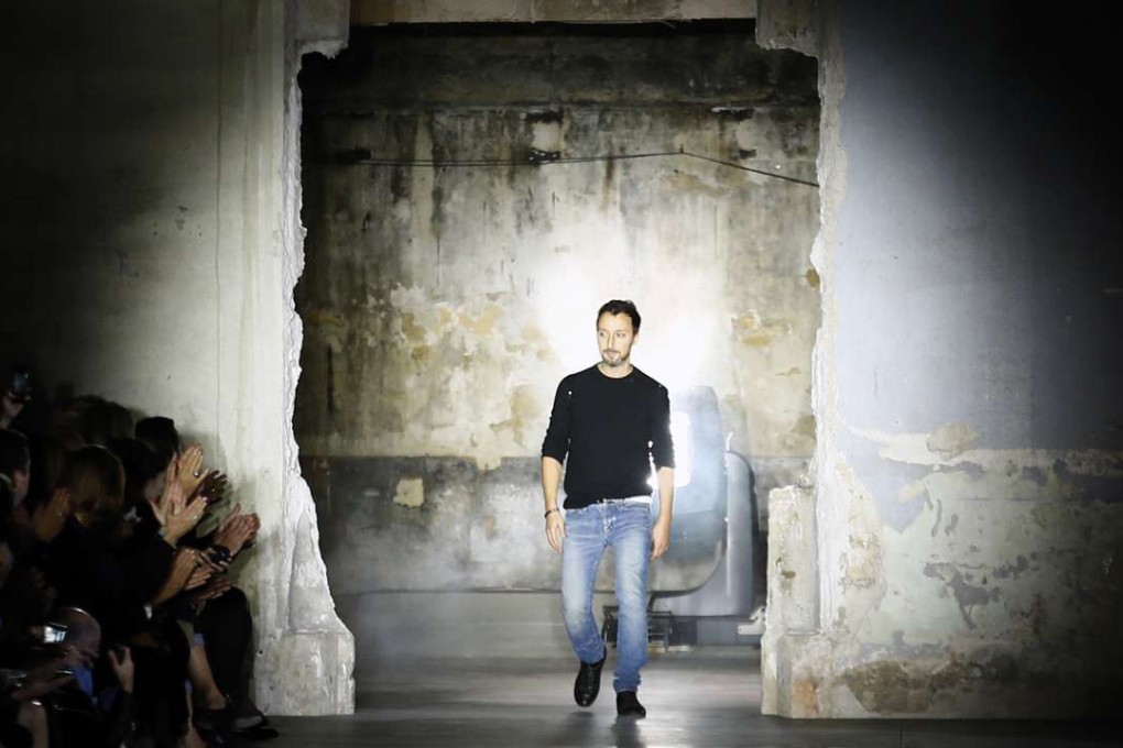 Anthony Vaccarello arrives on the catwalk at the end of Yves Saint Laurent Spring-Summer 2017 Ready-to-Wear fashion show. Photo: AP