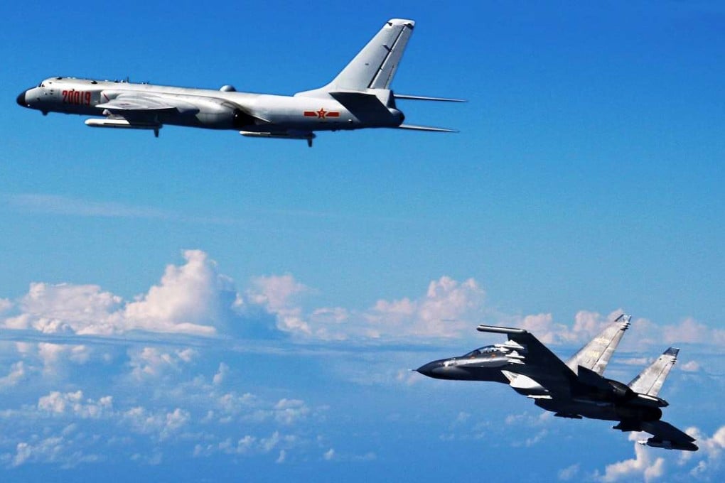 A state media photo shows a Chinese Su-30 fighter (right) flying with a H-6K bomber as they take part in a drill near the East China Sea on Sunday. Photo: Xinhua