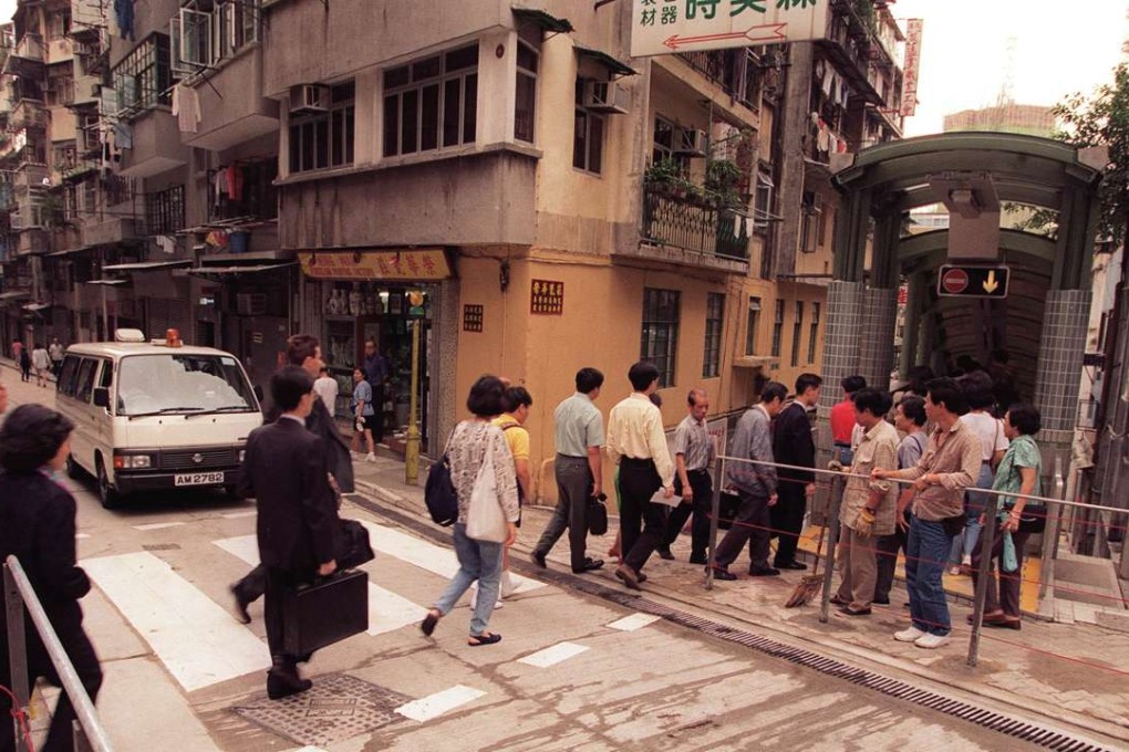 People try out the newly opened Mid-Levels escalator in 1993.