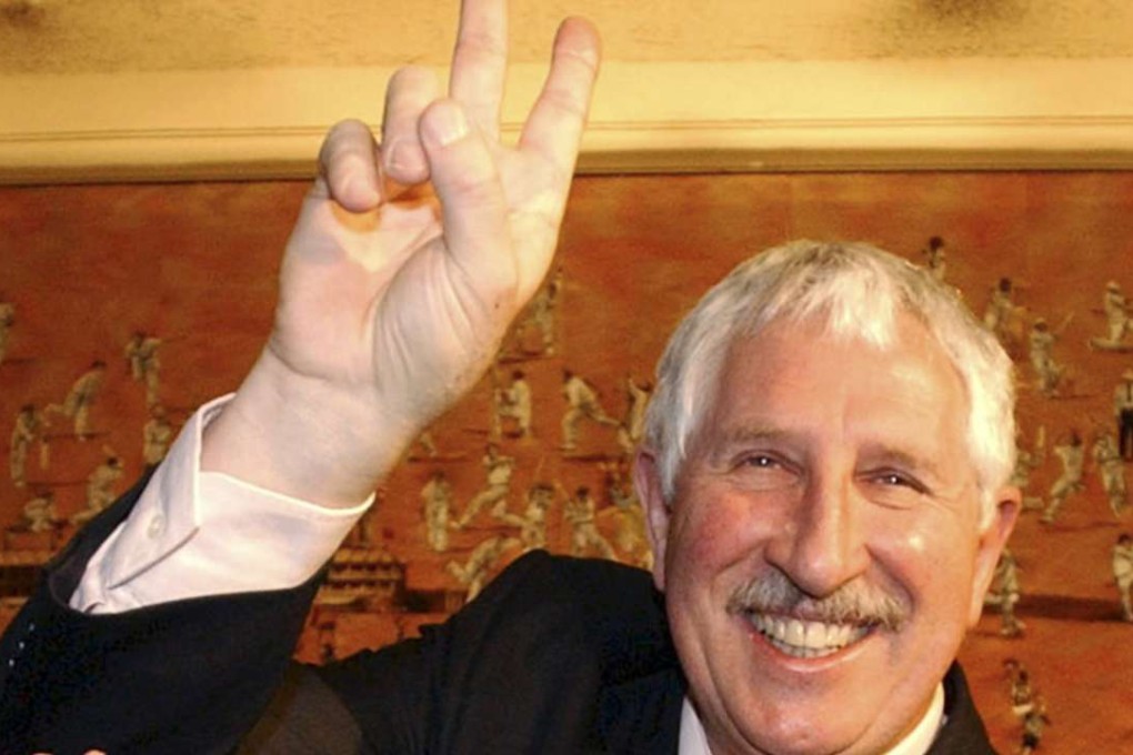 Max Walker demonstrates his trademark bowling action in the Long Room at the MCG in Melbourne in 2003. Walker died, aged 68, after a battle with cancer. Photo: AP